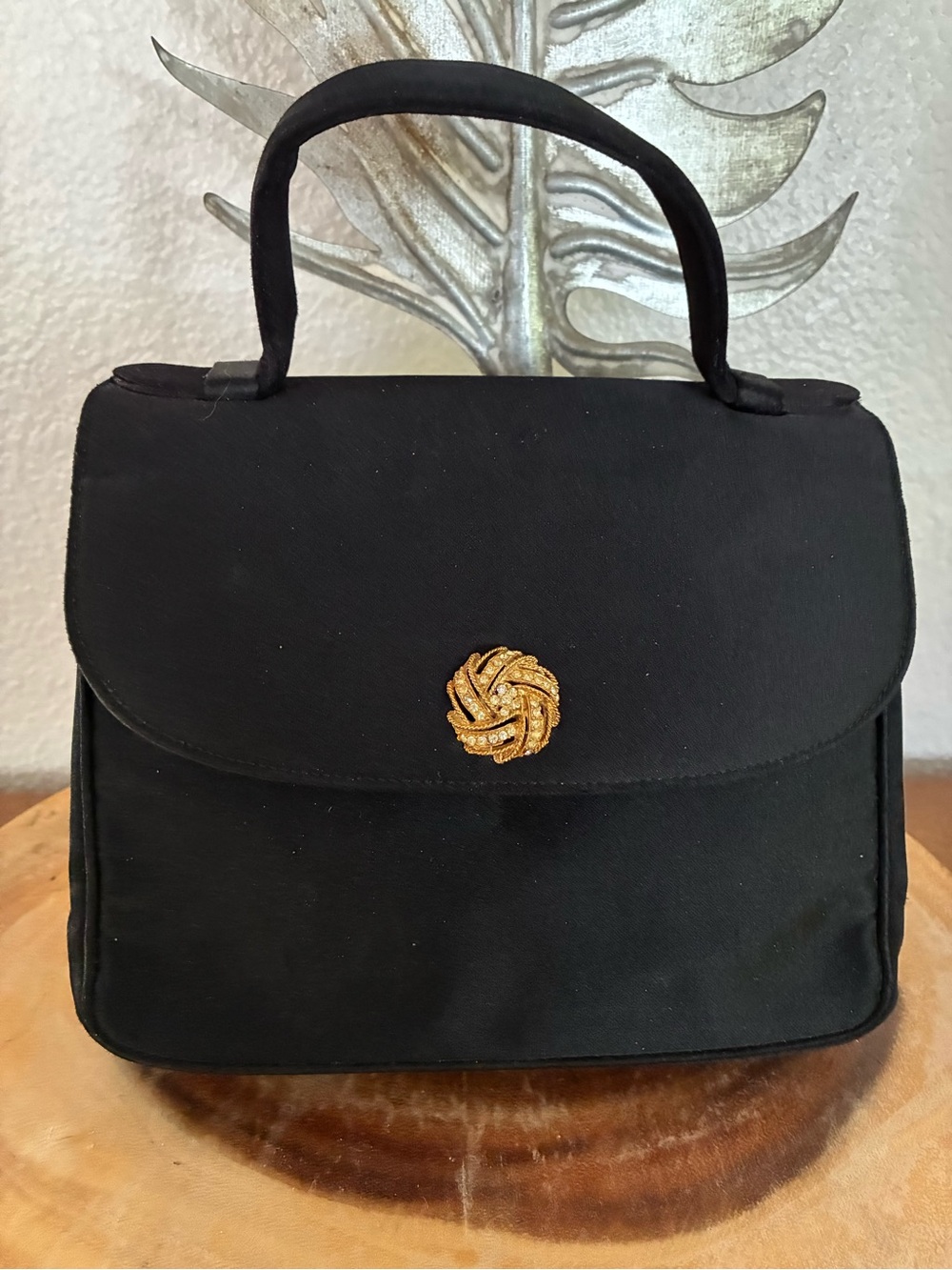 Vintage Bienen Davis Black Satin Top-Handle Satchel with Gold Knot Accent.